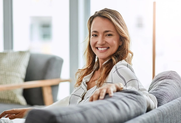 Smiling girl sitting and waiting in dental office waiting area