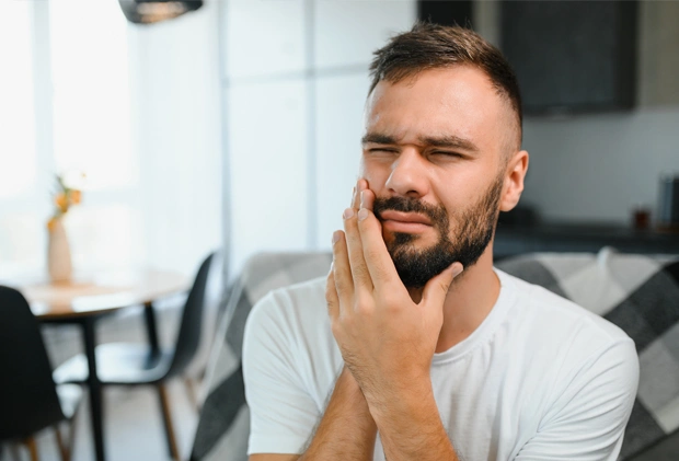 Man feeling dental anxiety before emergency treatment at  dental office 
