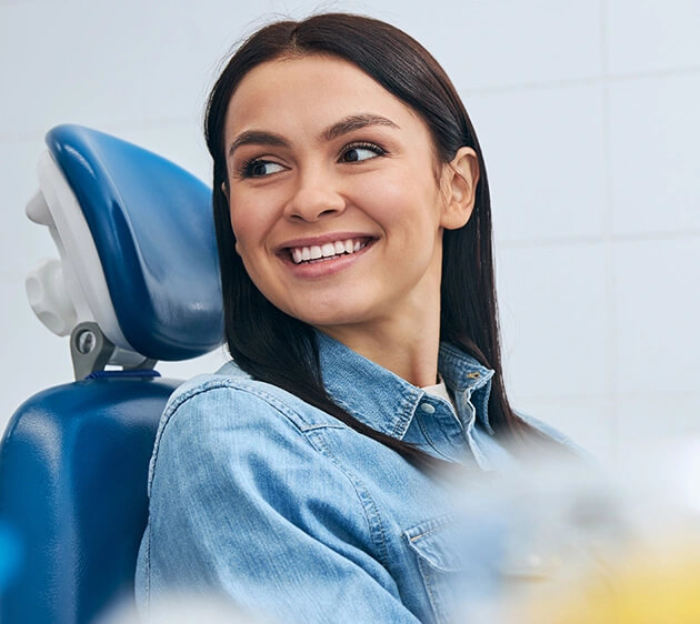 A girl seating on dentist chair and ready to treat a dentist in Location