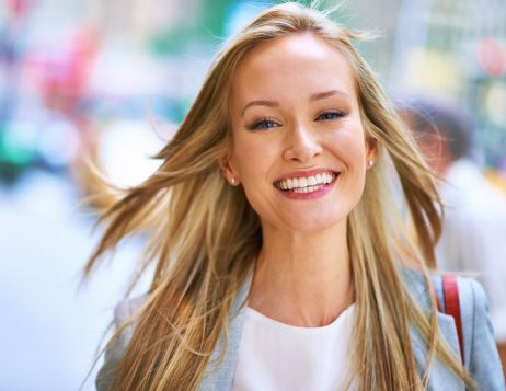 A beautiful girl smiling after attached dental crown in Burbank CA
