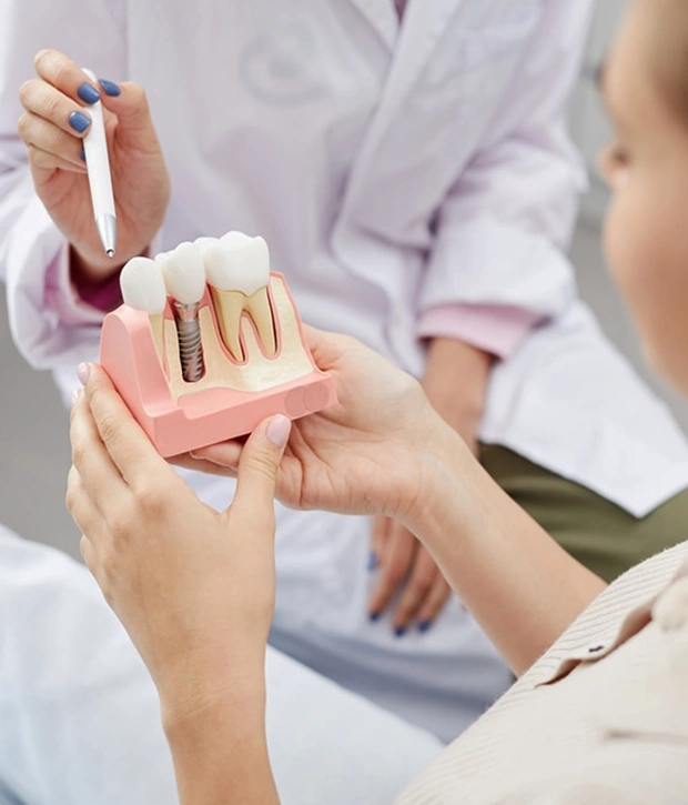Dental implant consultation with doctors and patient discussing treatment options
