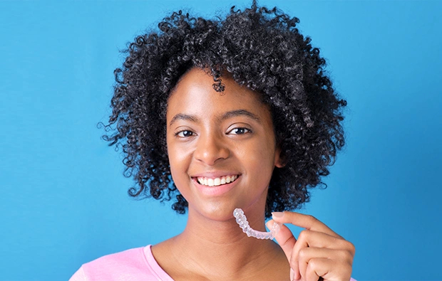 Woman posing with Invisalign