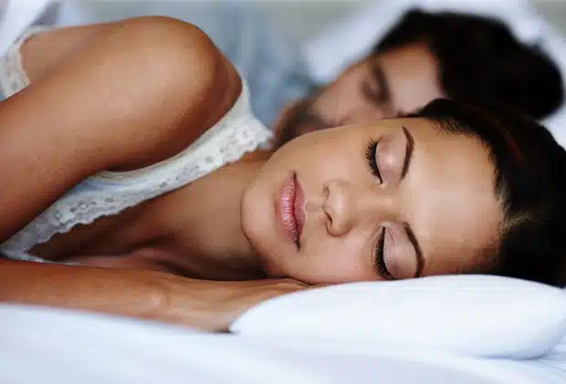 Peacefully sleeping couple after sleep apnea treatment